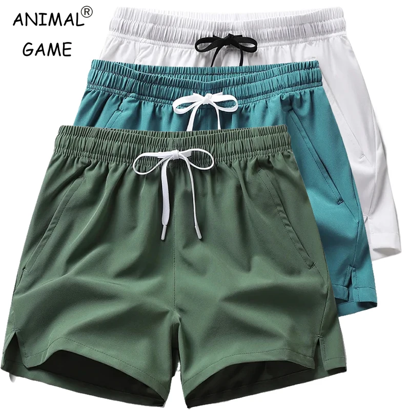 Pantalones de chándal ligeros de Fitness para hombre, pantalones cortos informales de verano con bolsillos, pantalones cortos básicos de Color sólido, pantalones cortos para correr en la playa para hombre